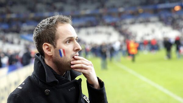 A French supporter reacts after invading the pitch of the Stade de France stadium at the end of the international friendly soccer match between France and Germany in Saint Denis, outside Paris, Friday, Nov. 13, 2015. - Sputnik Afrique