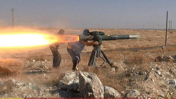 In this picture released on June 26, 2015, by a website of Islamic State militants, Islamic State militants fire an anti-tank missile in Hassakeh, northeast Syria - Sputnik Afrique