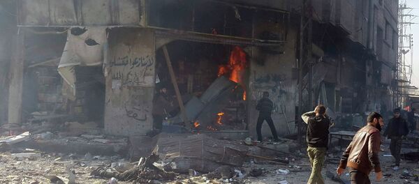 Residents react to dead bodies after what activists said was shelling by forces loyal to Syria's President Bashar al-Assad, in Hamouria main square and market, Eastern Al-Ghouta, near Damascus January 23, 2015. - Sputnik Afrique