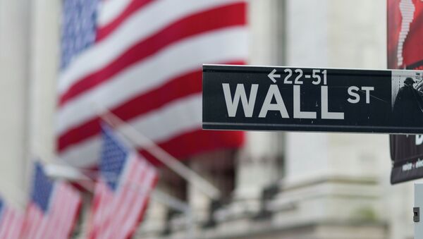 A Wall Street sign hangs near the New York Stock Exchange. - Sputnik Afrique