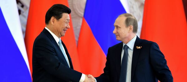Le président russe Vladimir Poutine et le président chinois Xi Jinping - Sputnik Afrique