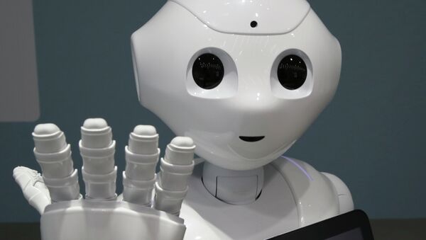 In this June 6, 2014 file photo, humanoid robot Pepper is on display at SoftBank mobile shop in Tokyo. Japanese mobile carrier Softbank said Tuesday, Feb. 10, 2015 it will incorporate artificial intelligence technology from IBM into its empathetic robot Pepper that goes on sale in Japan this month. - Sputnik Afrique