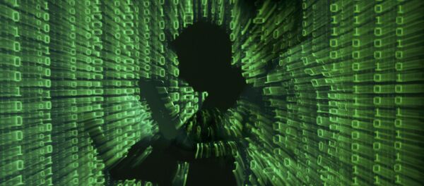 An illustration picture shows a projection of binary code on a man holding a laptop computer. An illustration picture shows a projection of binary code on a man holding a laptop computer. - Sputnik Afrique