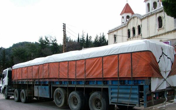 Les habitants de la ville syrienne de Kessab reçoivent une aide de Moscou et de Damas - Sputnik Afrique