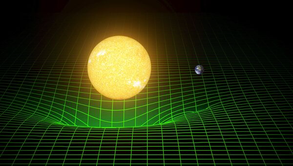 A computer simulation shows how our sun and Earth warp space and time, or spacetime, represented here with a green grid - Sputnik Afrique