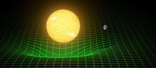 A computer simulation shows how our sun and Earth warp space and time, or spacetime, represented here with a green grid - Sputnik Afrique