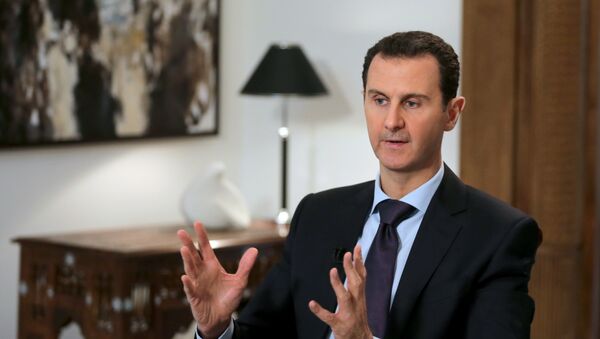 Syrian President Bashar al-Assad gestures during an exclusive interview with AFP in the capital Damascus on February 11, 2016. - Sputnik Afrique