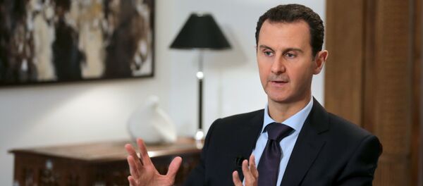 Syrian President Bashar al-Assad gestures during an exclusive interview with AFP in the capital Damascus on February 11, 2016. - Sputnik Afrique