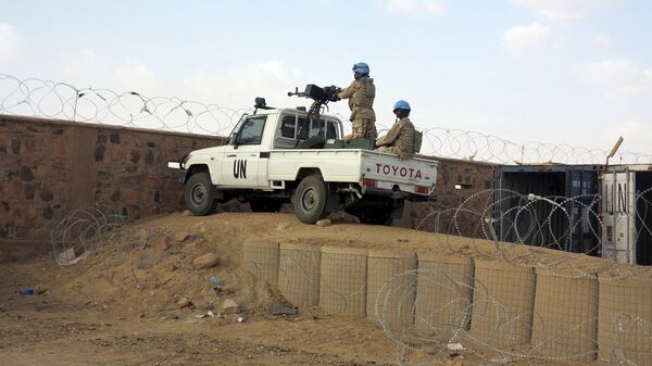 Peacekeepers stand guard at the entrance to the Minusma peacekeeping base in Kidal, Mali - Sputnik Afrique