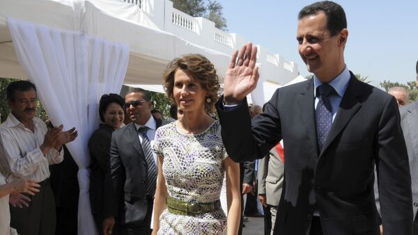 Syrian President Bashar Assad and his wife Asma Assad. (File) - Sputnik Afrique