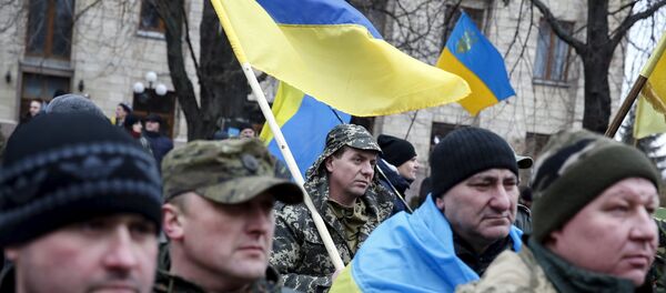 Members of self-defence battalions take part in a rally to commemorate demonstrators who were killed during the EuroMaidan protests in 2014 in Kiev, Ukraine, February 20, 2016. Members of self-defence battalions take part in a rally to commemorate demonstrators who were killed during the EuroMaidan protests in 2014 in Kiev, Ukraine, February 20, 2016. - Sputnik Afrique