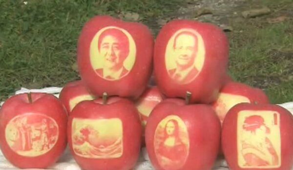 Des pommes avec la tête de Shinzo Abe et de François Hollande au Japon - Sputnik Afrique