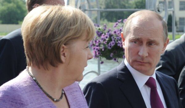 Poutine et Merkel discuteront de la situation en Ukraine au Brésil - Sputnik Afrique
