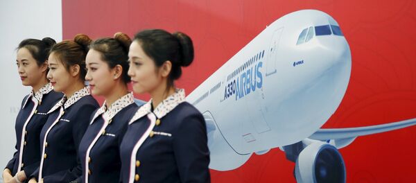 Staff members stand in front of a wall bearing the image of the Airbus A330 plane at a ground-breaking ceremony for the Airbus A330 completion and delivery center in Tianjin, China, March 2, 2016. Staff members stand in front of a wall bearing the image of the Airbus A330 plane at a ground-breaking ceremony for the Airbus A330 completion and delivery center in Tianjin, China, March 2, 2016. - Sputnik Afrique