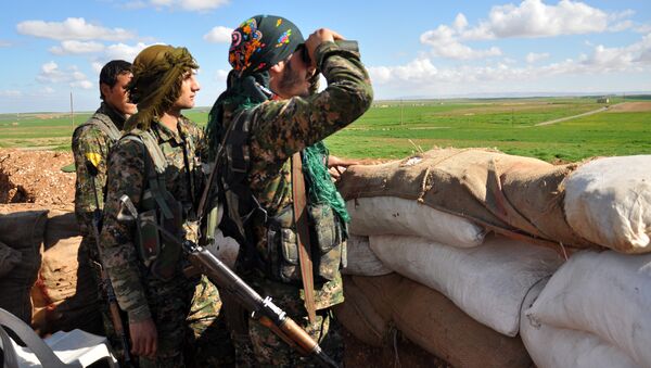 Les combattants des Unités kurdes de protection du peuple (YPG) - Sputnik Afrique