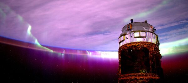 Astronaut Scott Kelly posted this photo of an aurora taken from the International Space Station to Instagram with the caption, Day 154. #Aurora's purple glow adds mystery to the nightscape. Good night from @ISS! - Sputnik Afrique