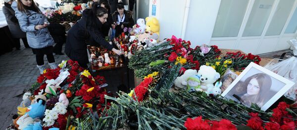 Des fleurs et des bougies en hommage aux victimes du crash de Rostov - Sputnik Afrique