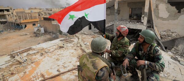 Les Faucons du désert et les milices populaires dans Palmyre libérée - Sputnik Afrique