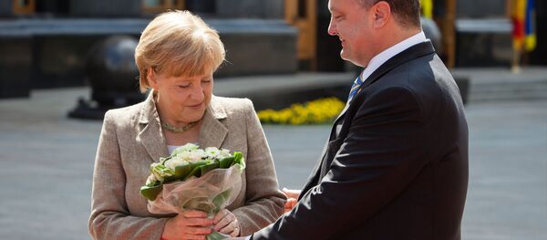 La chancelière allemande Angela Merkel et le président ukrainien Piotr Porochenko - Sputnik Afrique