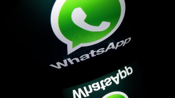 The logo of mobile app WhatsApp is displayed on a tablet on January 2, 2014 in Paris - Sputnik Afrique