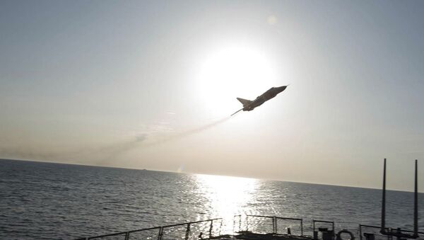 An U.S. Navy picture shows what appears to be a Russian Sukhoi SU-24 attack aircraft flying over the U.S. guided missile destroyer USS Donald Cook in the Baltic Sea in this picture taken April 12, 2016 and released April 13, 2016 - Sputnik Afrique