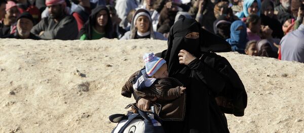 Près de 50.000 Syriens bloqués à la frontière avec la Jordanie Près de 50.000 Syriens bloqués à la frontière avec la Jordanie - Sputnik Afrique