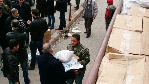 Distribution d'aide humanitaire russe dans la province syrienne de Lattaquié - Sputnik Afrique