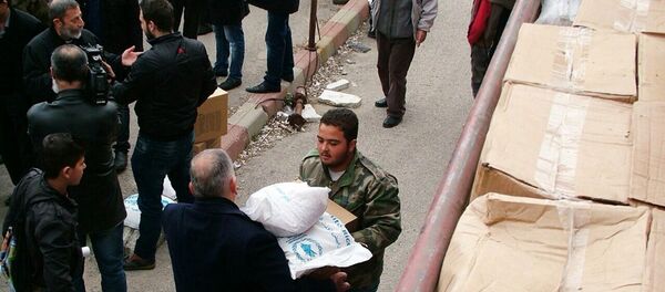 Distribution d'aide humanitaire russe dans la province syrienne de Lattaquié - Sputnik Afrique