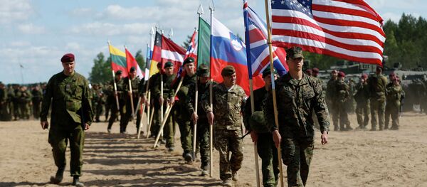 Soldiers from NATO countries attend an opening ceremony of military exercise 'Saber Strike 2015'. - Sputnik Afrique
