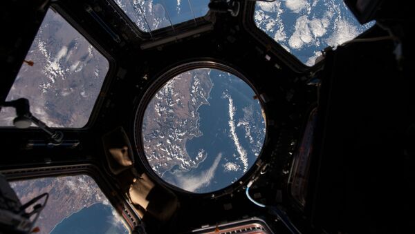 NASA astronaut Scott Kelly on the International Space Station took this Earth observation photo in the stations cupola that provides a 360 degree view. He tweeted this image with the comment: The view out my window. - Sputnik Afrique