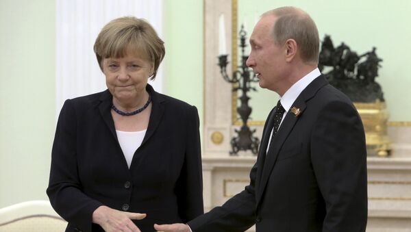 Angela Merkel et Vladimir Poutine - Sputnik Afrique