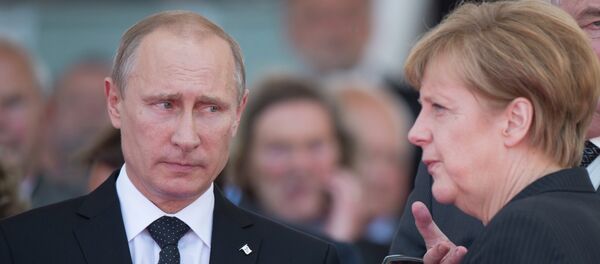 Vladimir Poutine et Angela Merkel - Sputnik Afrique