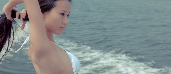 Une femme asiatique - Sputnik Afrique