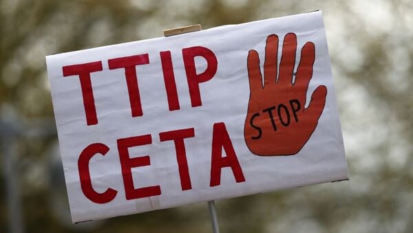 A placard against Comprehensive Economic and Trade Agreement (CETA) and Transatlantic Trade and Investment Partnership (TTIP) agreements is pictured during a demonstration ahead of U.S. President Obama's visit in Hannover - Sputnik Afrique