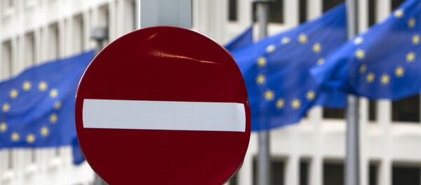 EU flags flutter in the wind in back of a no entry street sign in front of EU headquarters in Brussels on Friday, June 24, 2016. - Sputnik Afrique