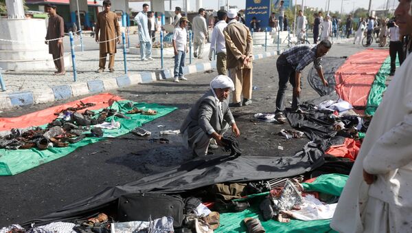 Collecte des vêtements des victimes de l'attentat-suicide à Kaboul - Sputnik Afrique