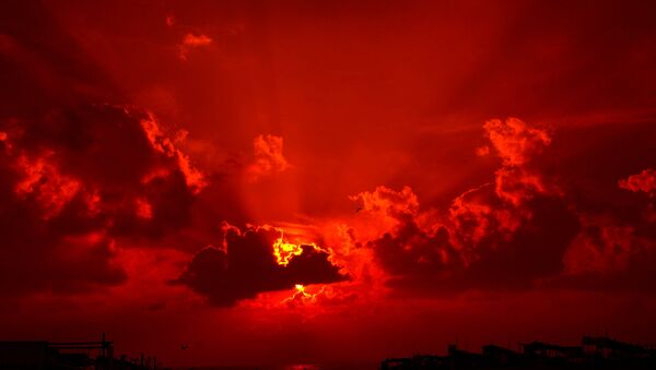 Un coucher de soleil rouge - Sputnik Afrique