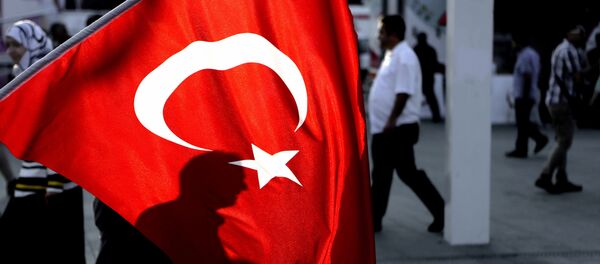 A man's shadow is seen behind a Turkish flag at Taksim square in Istanbul, on Saturday, July 30, 2016. - Sputnik Afrique