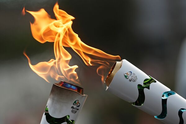 Le relais de la flamme olympique au Brésil - Sputnik Afrique
