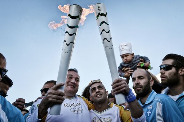 Le relais de la flamme olympique au Brésil - Sputnik Afrique