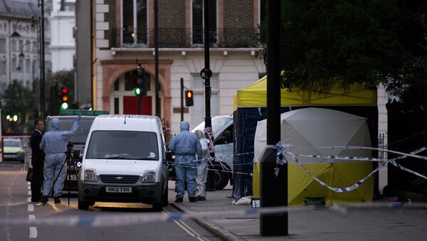 Police forensic officers work in Russell Square in London early on August 4, 2016, after a woman in her 60s was killed during a knife attack - Sputnik Afrique