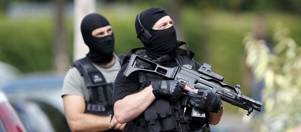 Members of French special police forces of Research and Intervention Brigade (BRI) are seen during a raid after a hostage-taking in the church in Saint-Etienne-du-Rouvray near Rouen in Normandy, France, July 26, 2016. - Sputnik Afrique