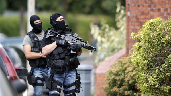 Members of French special police forces of Research and Intervention Brigade (BRI) are seen during a raid after a hostage-taking in the church in Saint-Etienne-du-Rouvray near Rouen in Normandy, France, July 26, 2016. - Sputnik Afrique