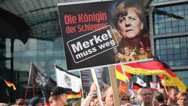 Une action de protestation contre la politique d'Angela Merkel à Berlin - Sputnik Afrique