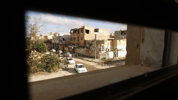 Cars drive down a road after fighters loyal to Libya's internationally recognised government seized the centre of the eastern coastal city of Benghazi on February 25, 2016 - Sputnik Afrique