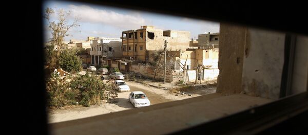 Cars drive down a road after fighters loyal to Libya's internationally recognised government seized the centre of the eastern coastal city of Benghazi on February 25, 2016 - Sputnik Afrique