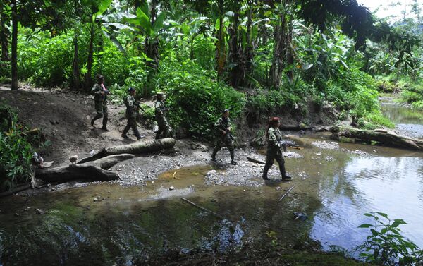 Les partisanes des FARC patrouillent les lieux - Sputnik Afrique