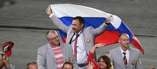 Российский флаг на открытии ХV летних Паралимпийских игр 2016 в Рио-де-Жанейро - Sputnik Afrique