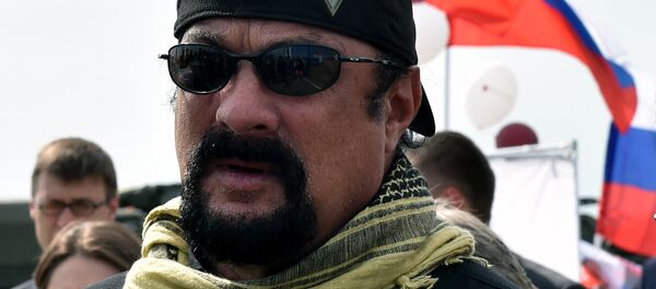 US action movie actor Steven Seagal takes part in the military exhibition Oboronexpo-2014 in Zhukovsky outside Moscow, on August 14, 2014. - Sputnik Afrique
