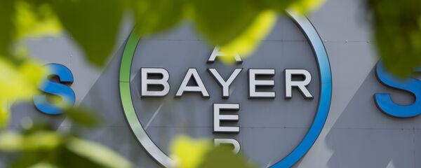 This file photo taken on July 24, 2013 shows a logo of German pharmaceuticals and chemicals giant Bayer on an overpass at its Berlin headquarters - Sputnik Afrique